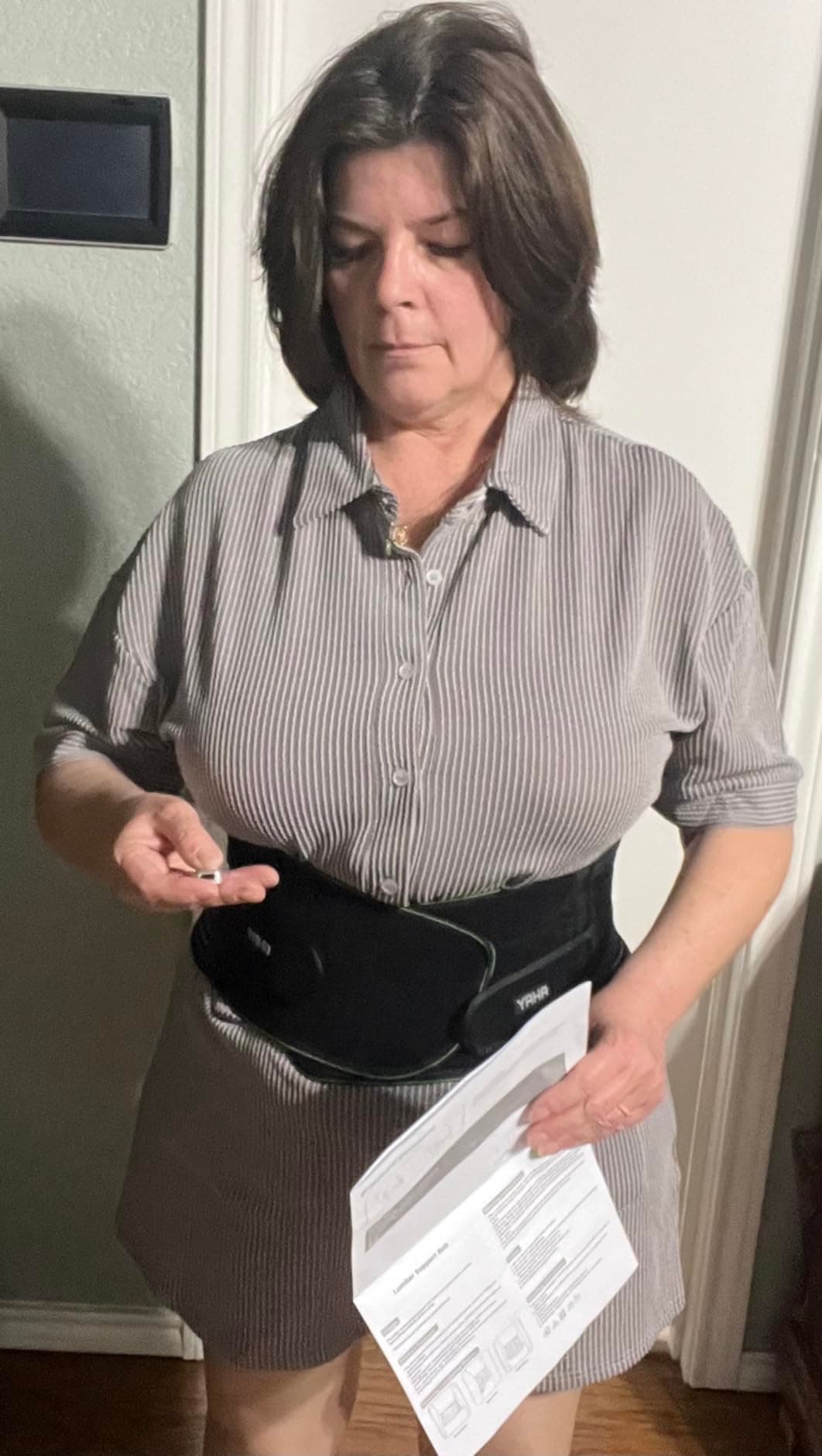 Customer holding the belt and the included instruction guide